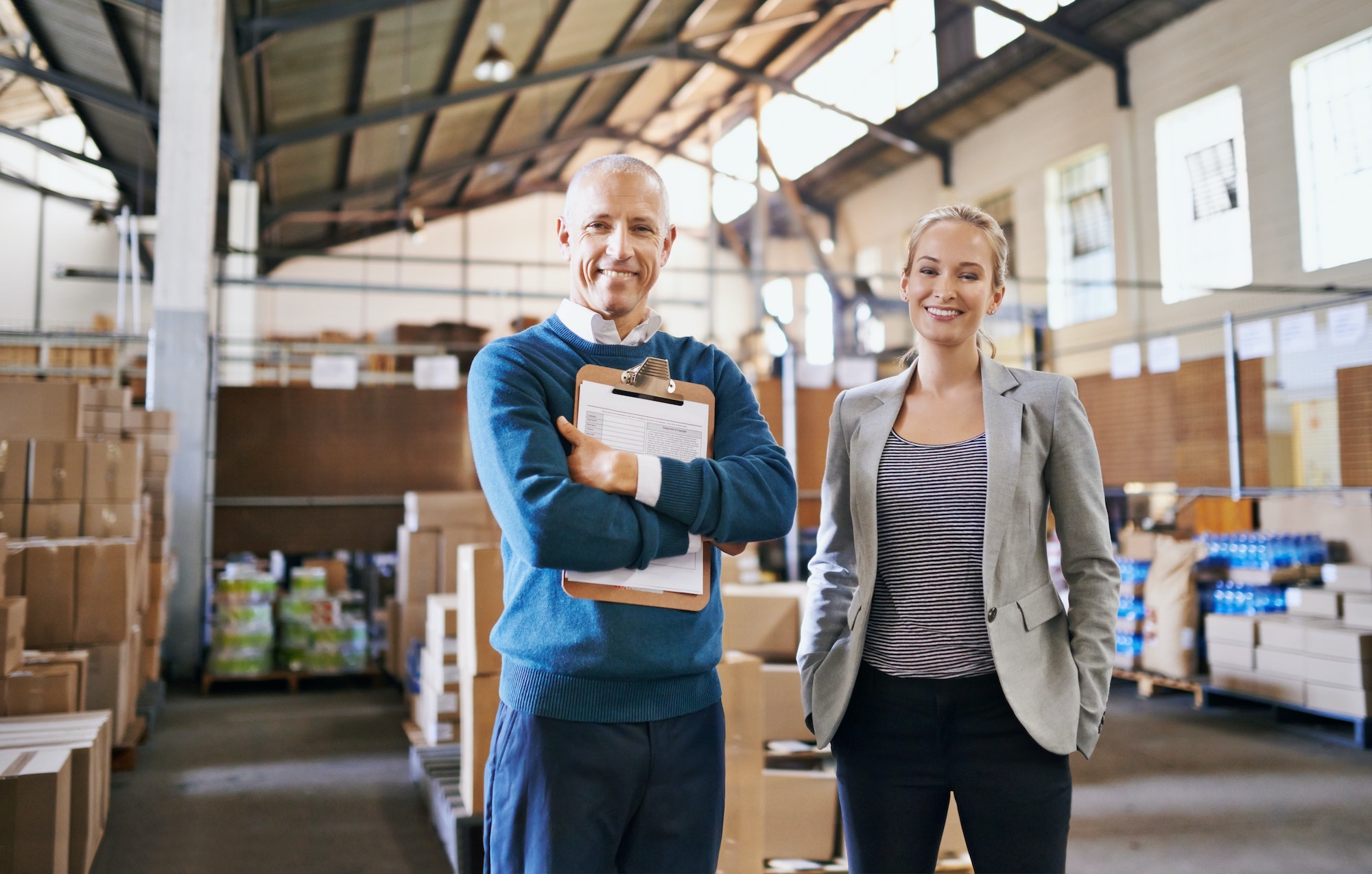 Portrait of two managers standing in a distribution warehouse